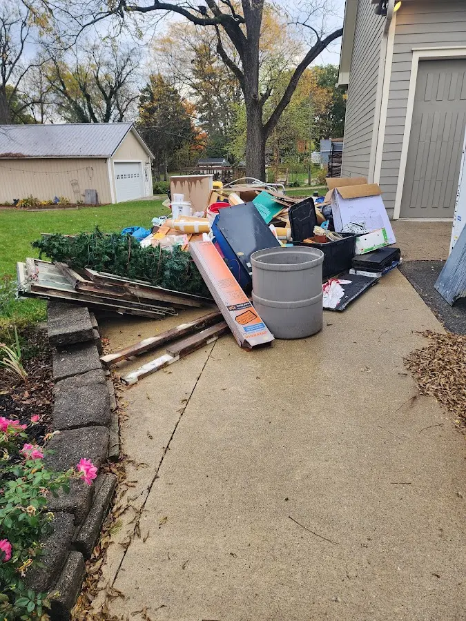 Dumpster being loaded with debris for 30 Yard Dumpster Rental in Annandale